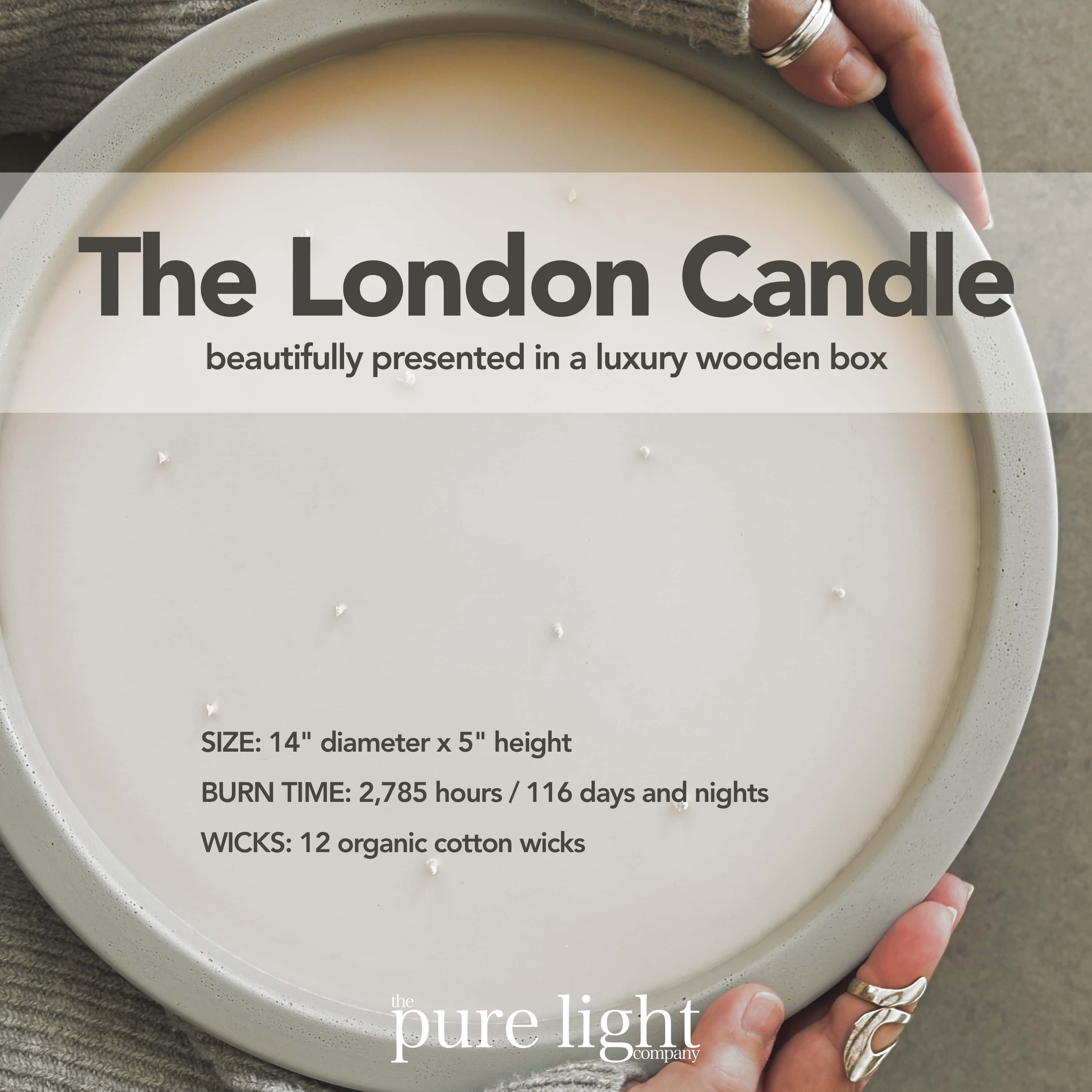 A huge, round Shampure Aveda Dupe concrete candle called "The London" with 19 wicks hugged by pretty hands wearing silver rings.