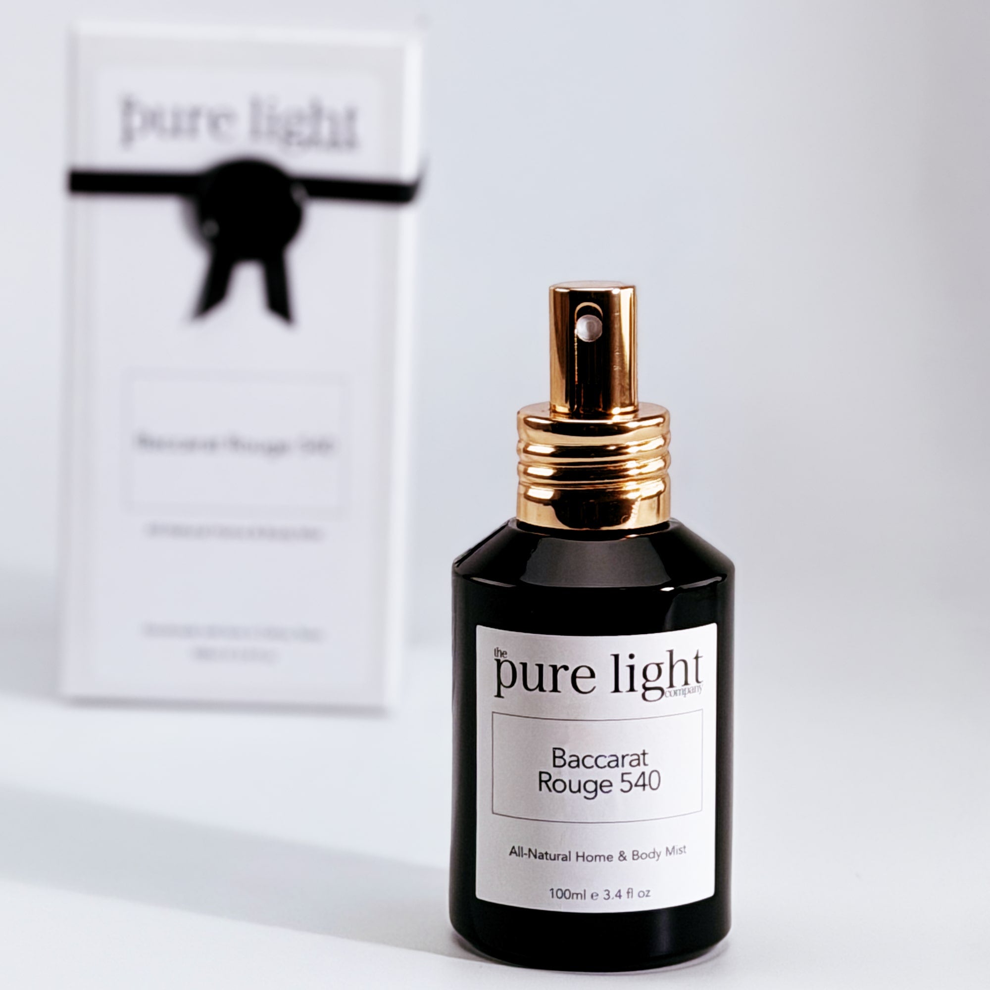 A black glossy bottle of Baccarat Rouge 540 All-Natural Spray Mist 100ml by The Pure Light Company