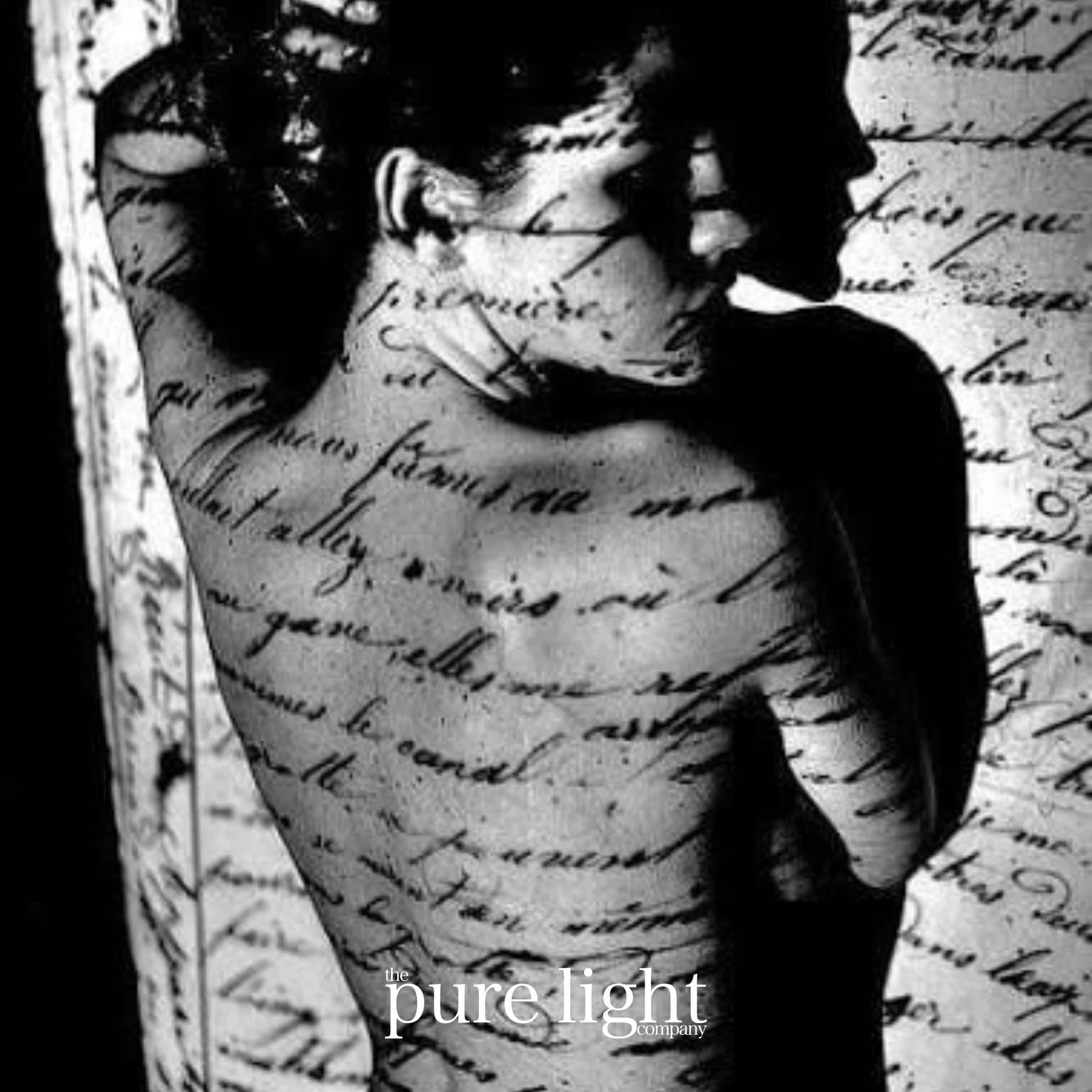 Black and white image of a person with text overlay, featuring the brand The Pure Light Company.