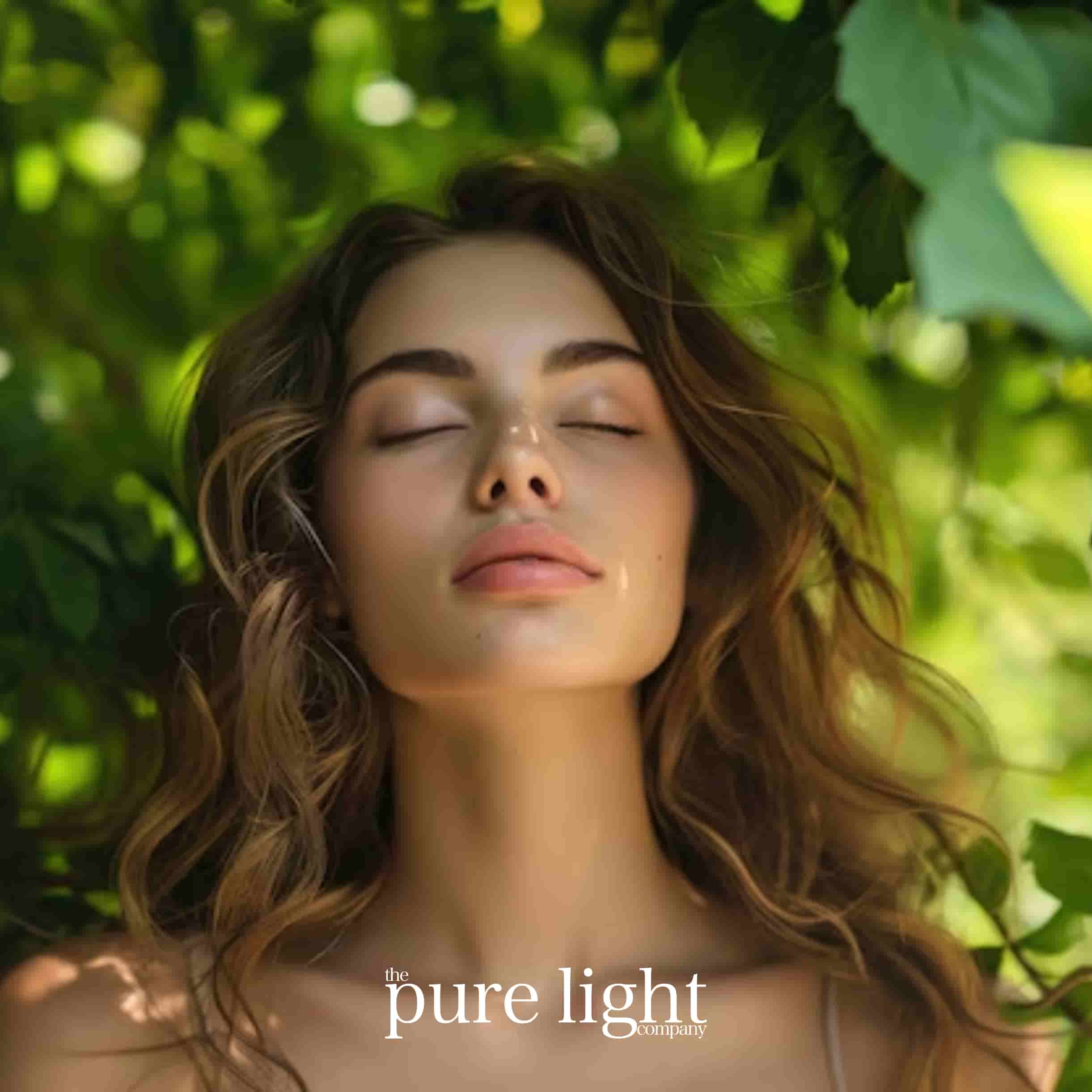 A woman with her eyes closed and her head tilted back, appearing relaxed and serene with The Pure Light Company logo.