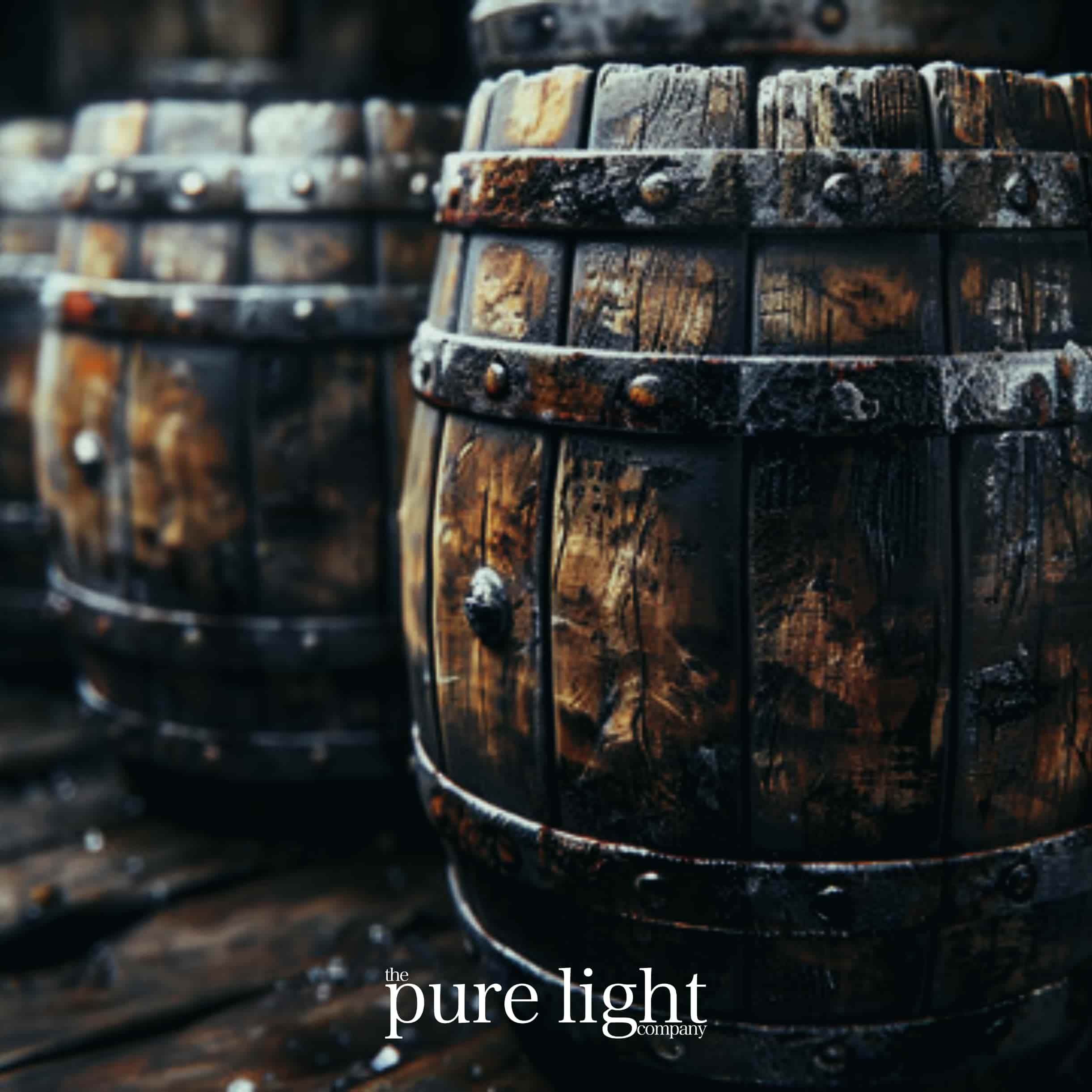 An image of two old wooden barrels to evoke a rustic aesthetic for The Pure Light Company's Gun Powder all-natural home fragrance. 