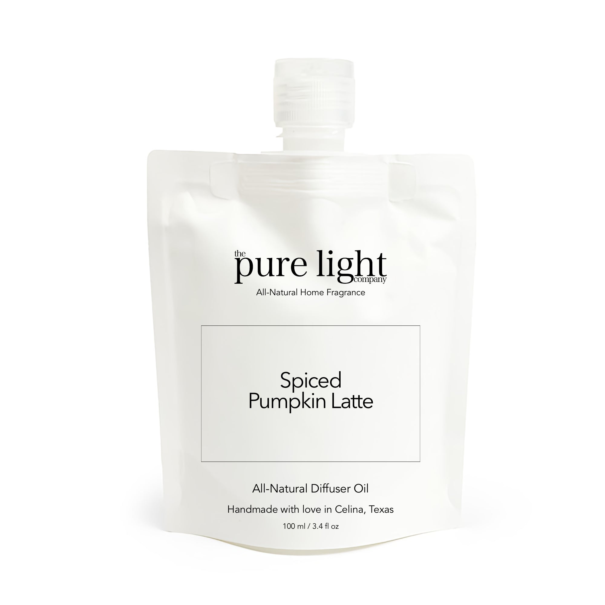 White packaging of The Pure Light Company diffuser oil with 'Spiced Pumpkin Latte' text on a white background